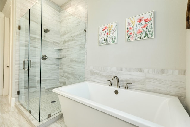 12 Caravelle Ct, Galveston, TX 77554 - full bath featuring a freestanding bath, a shower stall, and marble finish flooring
