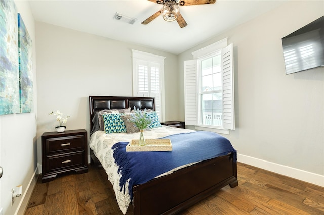 12 Caravelle Ct, Galveston, TX 77554 - bedroom with baseboards, wood finished floors, and ceiling fan