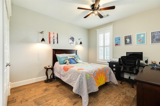 12 Caravelle Ct, Galveston, TX 77554 - bedroom featuring baseboards, wood finished floors, an office area, and a ceiling fan