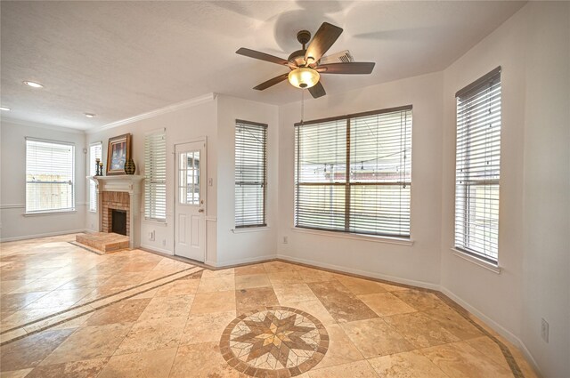 foyer featuring baseboards, plenty of natural light, and a brick fireplace