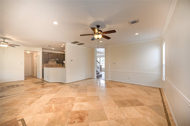unfurnished living room with crown molding, a ceiling fan, recessed lighting, and visible vents