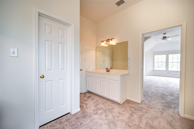 bathroom featuring carpet flooring, ceiling fan, vanity, baseboards, and visible vents