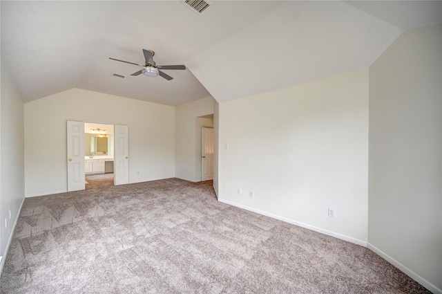 interior space with visible vents, carpet, and lofted ceiling