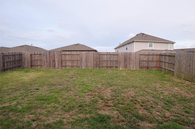 view of yard featuring a fenced backyard