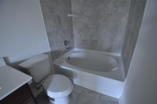 bathroom featuring vanity, tile patterned floors, toilet, and shower / washtub combination