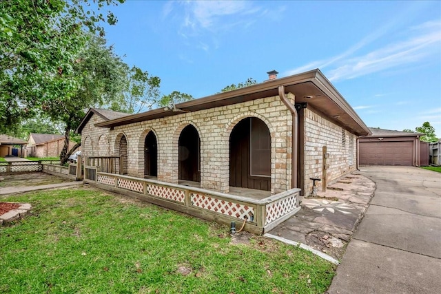 11438 Sageyork Dr, Houston, TX 77089 - view of front of property featuring stone siding, an outdoor structure, a front yard, and a garage
