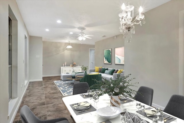 11438 Sageyork Dr, Houston, TX 77089 - dining area with ceiling fan with notable chandelier, baseboards, and recessed lighting