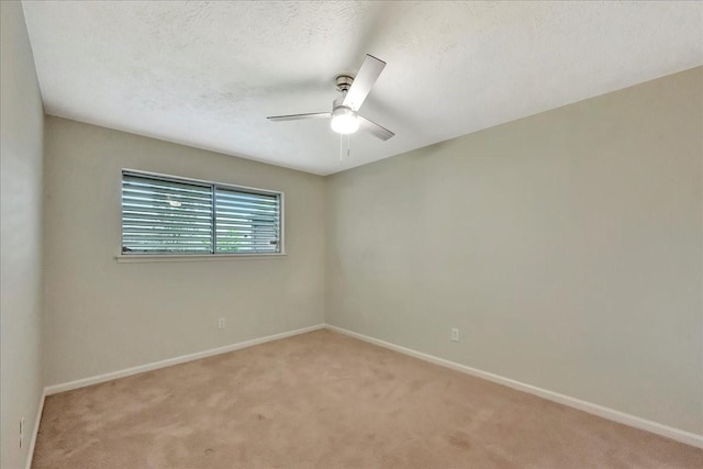 11438 Sageyork Dr, Houston, TX 77089 - spare room featuring light colored carpet, a textured ceiling, baseboards, and ceiling fan