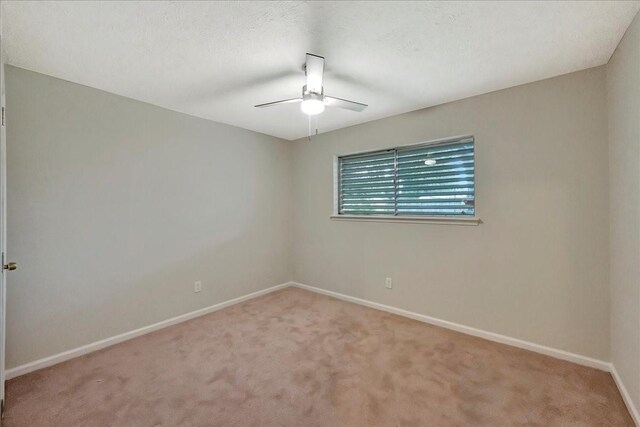 11438 Sageyork Dr, Houston, TX 77089 - empty room with a ceiling fan, baseboards, and light carpet
