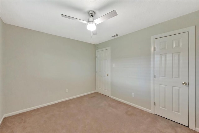 11438 Sageyork Dr, Houston, TX 77089 - unfurnished bedroom with baseboards, visible vents, light carpet, and ceiling fan
