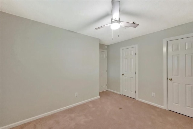 11438 Sageyork Dr, Houston, TX 77089 - unfurnished bedroom with baseboards, light colored carpet, and ceiling fan