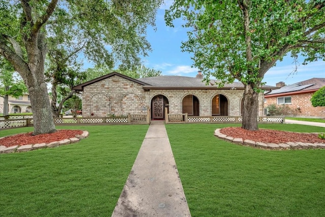 11438 Sageyork Dr, Houston, TX 77089 - view of front of property with a shingled roof, fence, a front yard, and stone siding