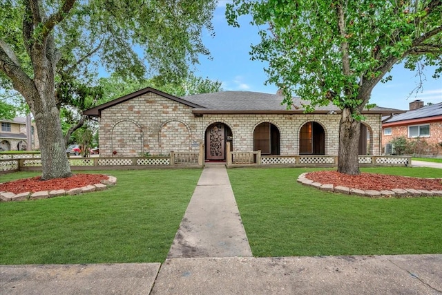 11438 Sageyork Dr, Houston, TX 77089 - view of front of house with a porch, a shingled roof, a front lawn, and stone siding