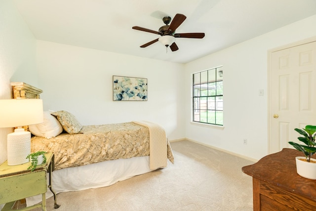 bedroom featuring carpet floors, baseboards, and ceiling fan