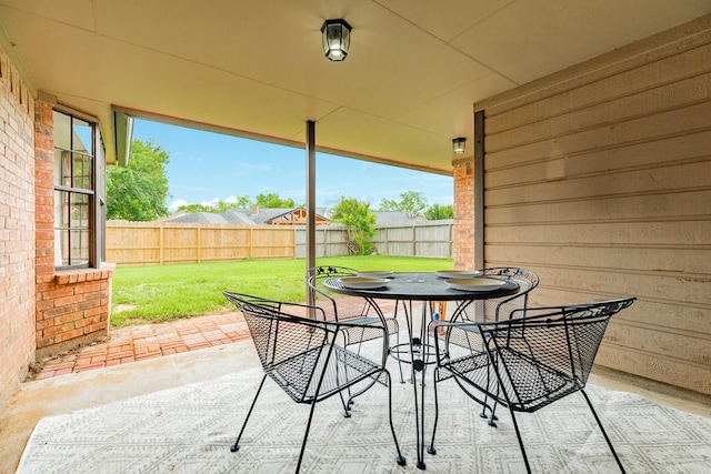 view of patio / terrace with outdoor dining space and a fenced backyard