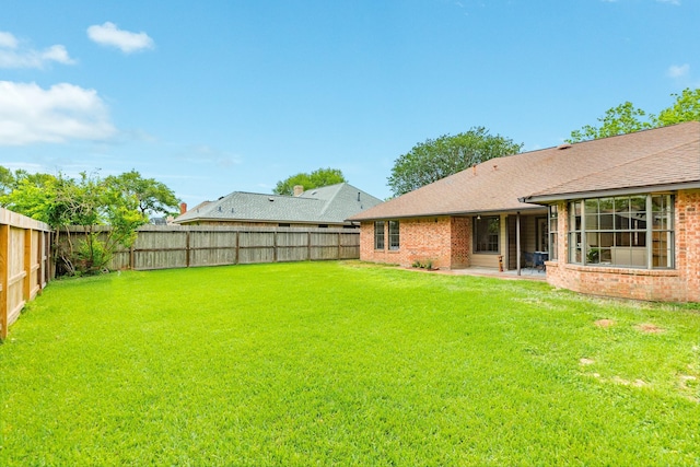 view of yard featuring a fenced backyard and a patio