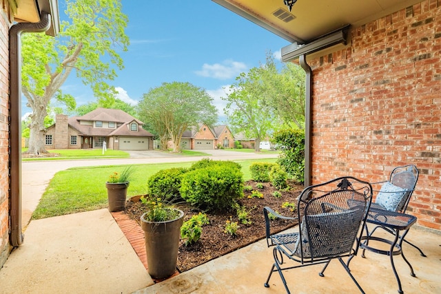 view of patio with a residential view and outdoor dining area