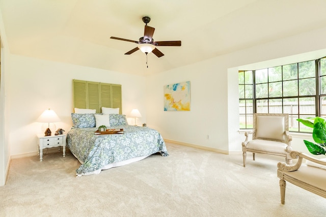 carpeted bedroom with baseboards and ceiling fan