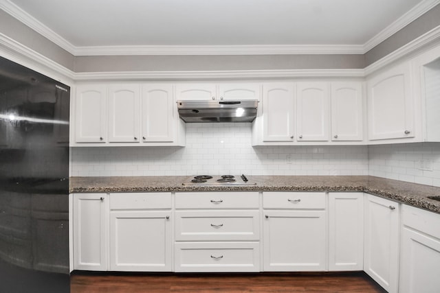 15510 Jersey Dr, Jersey Village, TX 77040 - kitchen featuring under cabinet range hood, electric cooktop, black refrigerator, dark stone countertops, and crown molding