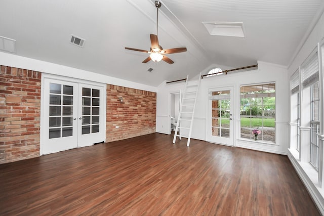 15510 Jersey Dr, Jersey Village, TX 77040 - unfurnished living room with french doors, brick wall, ceiling fan, and wood finished floors