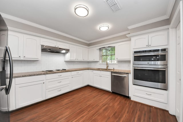 15510 Jersey Dr, Jersey Village, TX 77040 - kitchen featuring stainless steel appliances, under cabinet range hood, stone counters, crown molding, and white cabinets