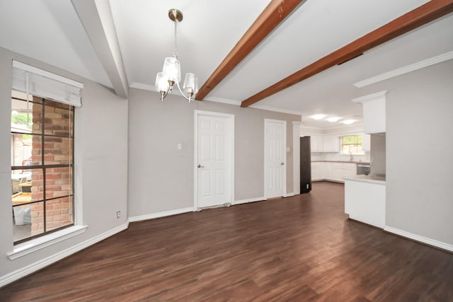 15510 Jersey Dr, Jersey Village, TX 77040 - unfurnished living room with a chandelier, beamed ceiling, and dark wood-type flooring