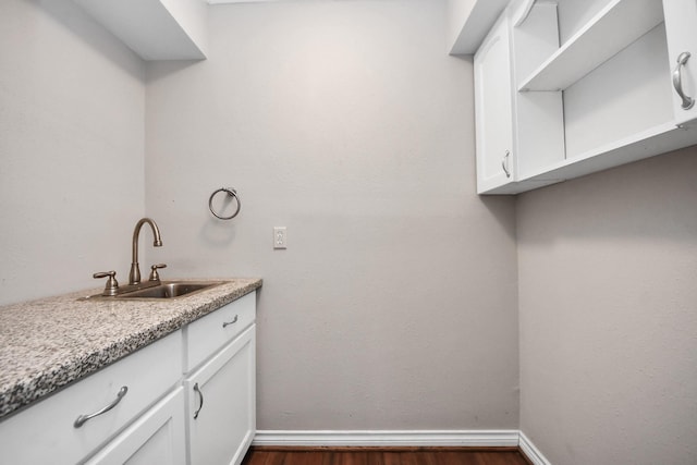 15510 Jersey Dr, Jersey Village, TX 77040 - laundry area with dark wood-style flooring