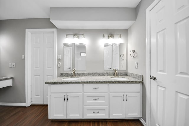 15510 Jersey Dr, Jersey Village, TX 77040 - full bath featuring double vanity, a sink, baseboards, and wood finished floors