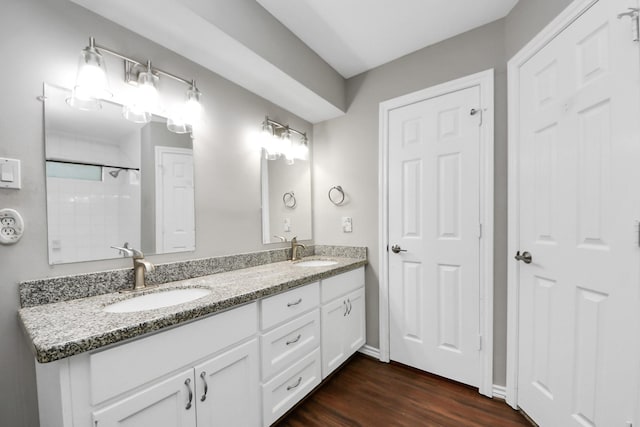 15510 Jersey Dr, Jersey Village, TX 77040 - full bathroom with double vanity and wood finished floors