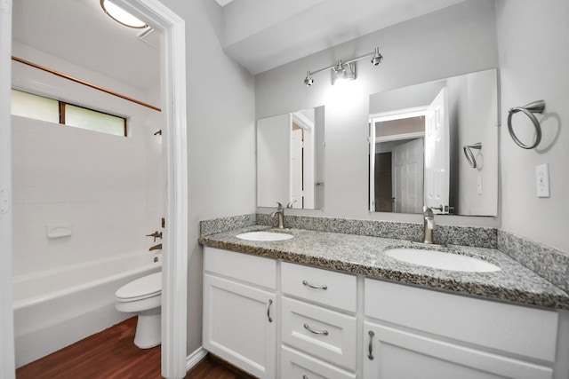 15510 Jersey Dr, Jersey Village, TX 77040 - full bath featuring double vanity, wood finished floors, and shower / washtub combination