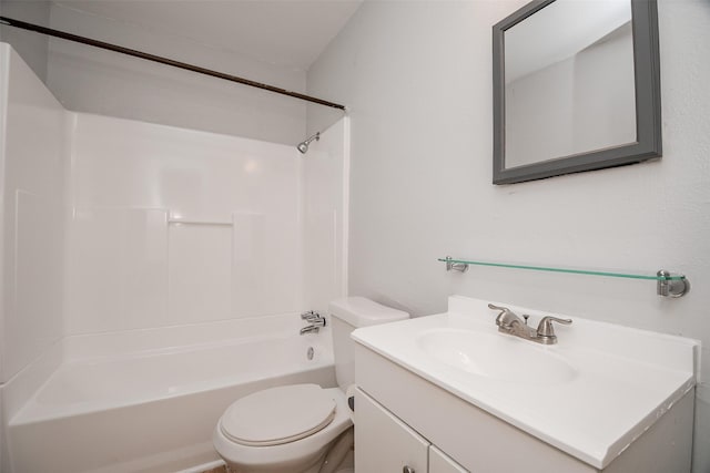 bathroom with toilet,  shower combination, and vanity