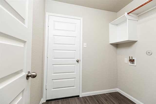 laundry area with laundry area, washer hookup, dark wood-style flooring, and baseboards