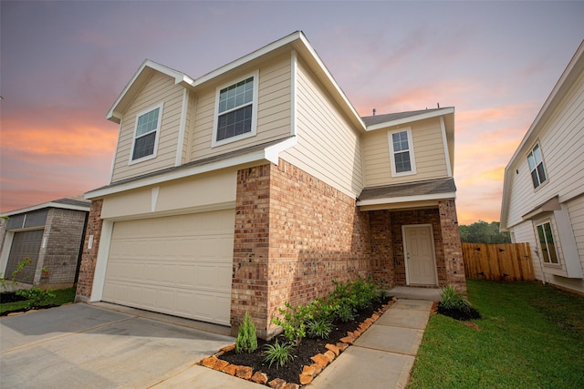 2897 Briggs Dr, Conroe, TX 77301 - traditional-style home with a garage, fence, a front yard, brick siding, and concrete driveway