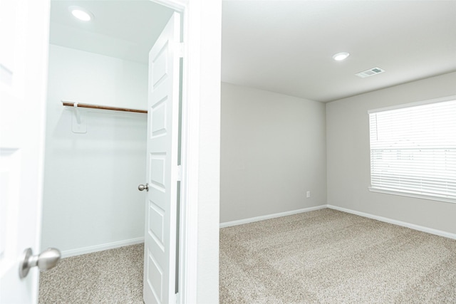 2897 Briggs Dr, Conroe, TX 77301 - unfurnished bedroom featuring carpet flooring, recessed lighting, baseboards, and visible vents