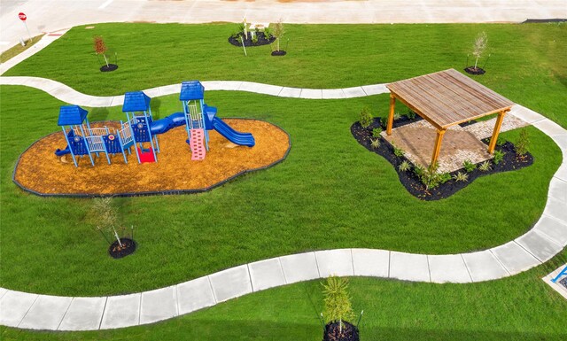 2897 Briggs Dr, Conroe, TX 77301 - view of community with a lawn and playground community