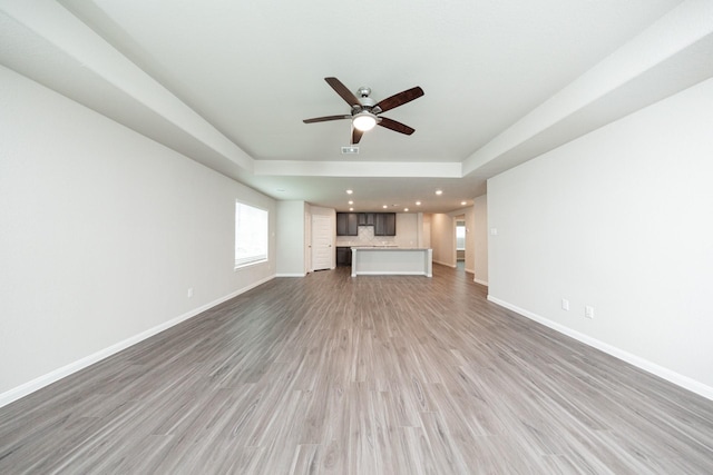 5107 Hector Gustavo Dr, Rosharon, TX 77583 - unfurnished living room with recessed lighting, baseboards, a ceiling fan, and light wood-style floors