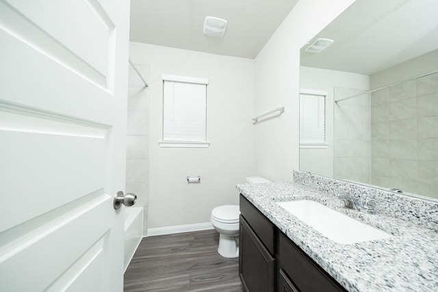 5107 Hector Gustavo Dr, Rosharon, TX 77583 - full bath featuring toilet, wood finished floors, bathing tub / shower combination, baseboards, and vanity