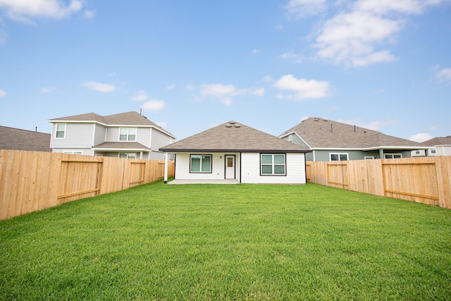 5107 Hector Gustavo Dr, Rosharon, TX 77583 - back of property featuring a yard, a patio, and a fenced backyard