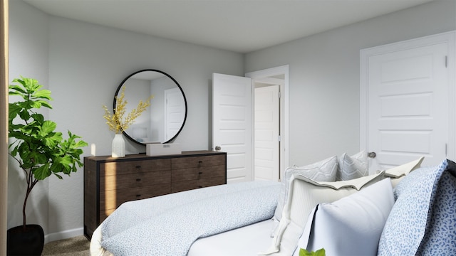 bedroom with baseboards and carpet