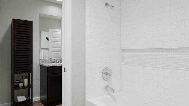 full bath featuring shower / bath combination, baseboards, and vanity
