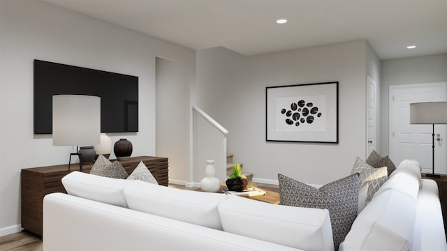 living room featuring baseboards, recessed lighting, stairs, and wood finished floors