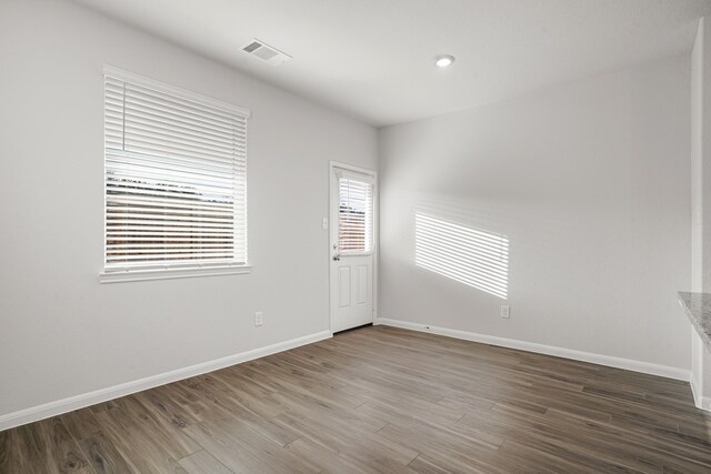 13617 Goldeye Dr, Conroe, TX 77384 - empty room featuring baseboards, visible vents, and wood finished floors