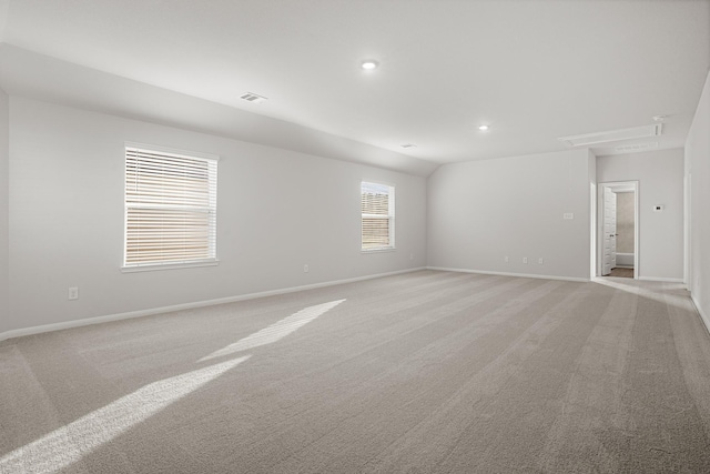 13617 Goldeye Dr, Conroe, TX 77384 - empty room featuring baseboards, visible vents, light carpet, and attic access