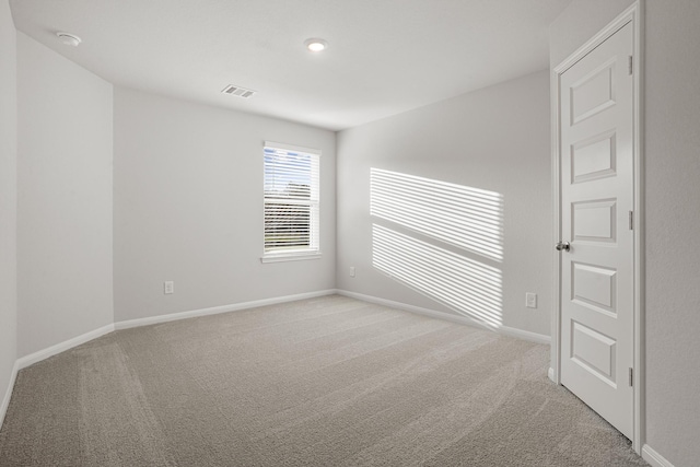 13617 Goldeye Dr, Conroe, TX 77384 - unfurnished room featuring baseboards, visible vents, and carpet
