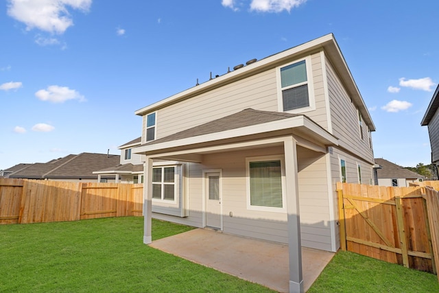 13617 Goldeye Dr, Conroe, TX 77384 - rear view of property with a fenced backyard, a yard, and a patio area