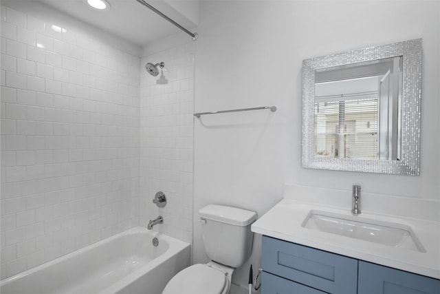 bathroom with vanity, bathing tub / shower combination, and toilet