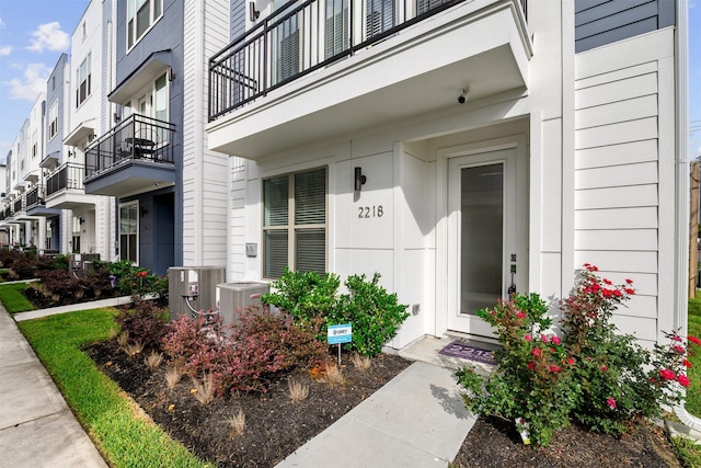 entrance to property featuring central AC unit