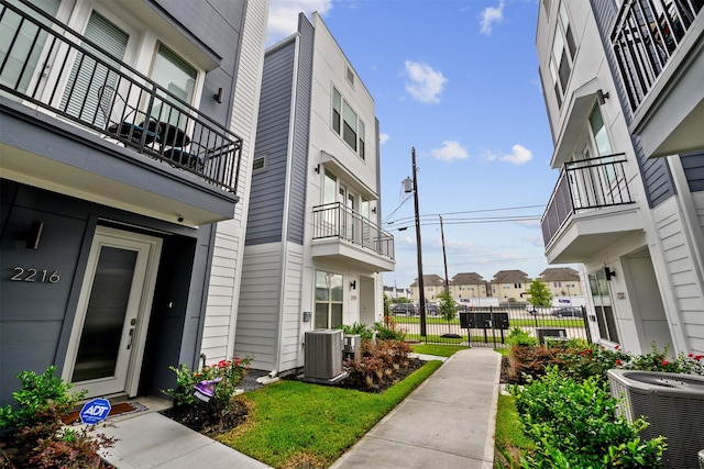 view of property's community with fence and a residential view
