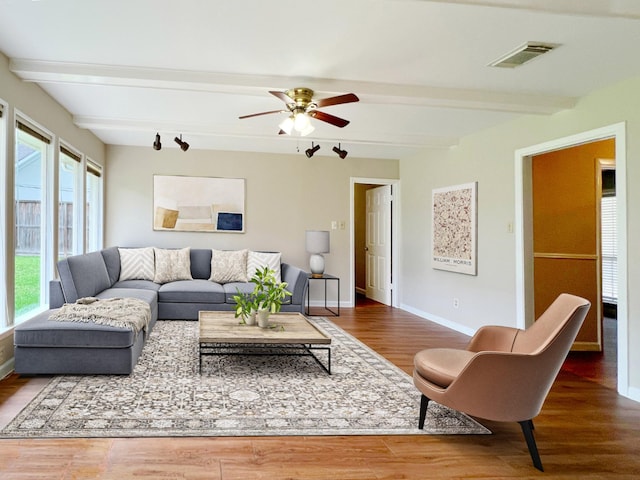 4616 Birch St, Bellaire, TX 77401 - living room featuring beam ceiling, wood finished floors, ceiling fan, and baseboards