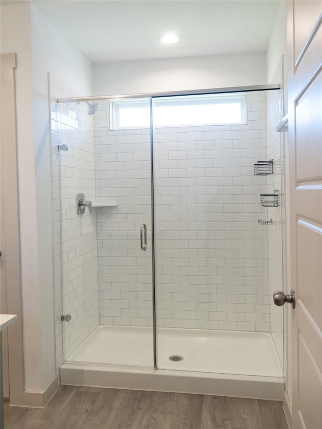 711 Boer Plains Dr, Rosharon, TX 77583 - bathroom with a stall shower and wood finished floors